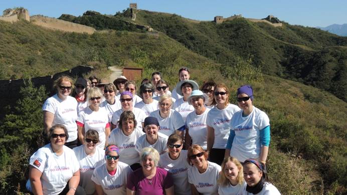 Group of Great Wall of China trekkers in Girls Can Do Anything t-shirts