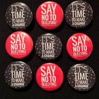 Badges printed with "say no to bullying"