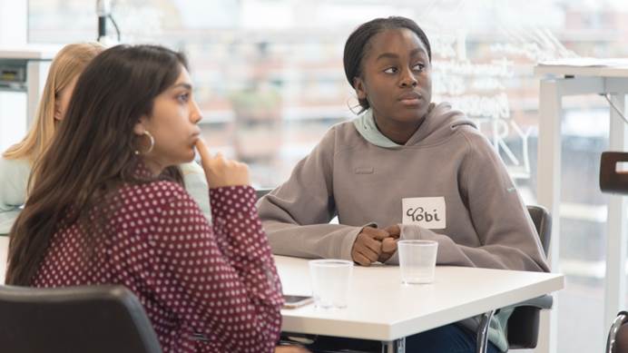 Two members of The Senior Section listen to a speaker