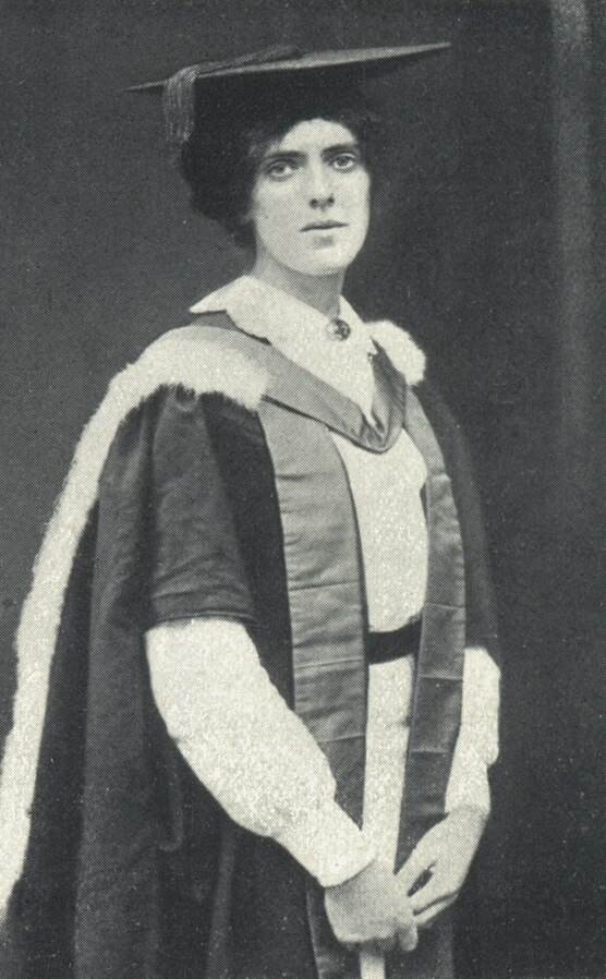 A black and white photograph of Nina Cameron Graham in graduation robes