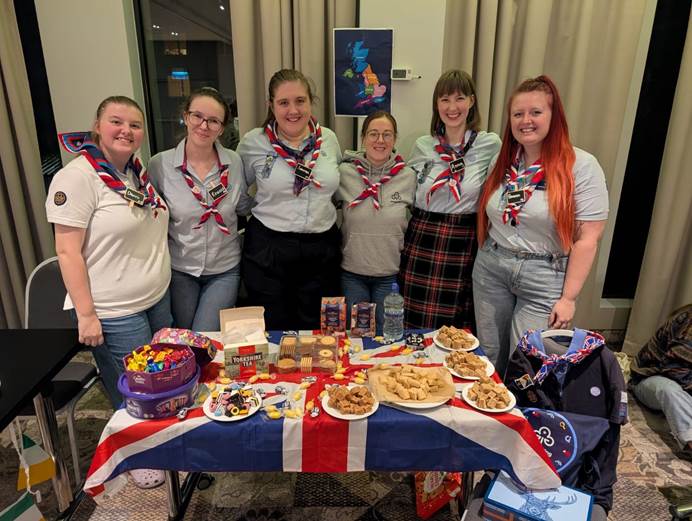 Gemma, Anna, Rowena, Lauren, Emma and Danni in front of a table of snacks
