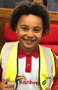 Katie Mellor's niece Amelia smiling in her Rainbows uniform