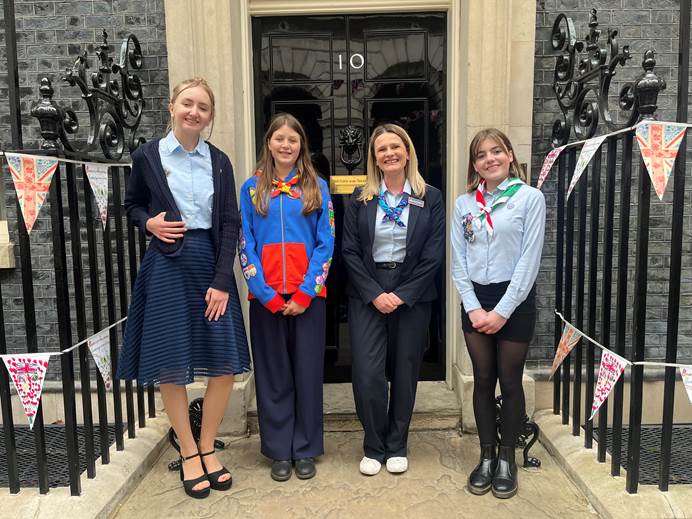 Mhairi with young members Chloe, Willemina and Alwen on steps of Number 10 Downing Street