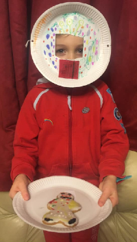 Rachael Parry's daughter Eva, a Rainbow, in fancy dress as a plate with a homemade biscuit