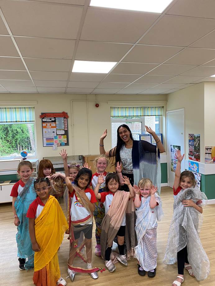 Group of Rainbows and their leader dressed in colourful saris