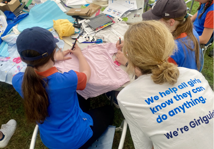 Girls participate in our dream design workshops with a volunteer