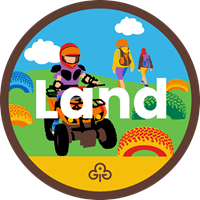 Brownie land adventure badge with graphics of girls quad biking and walking