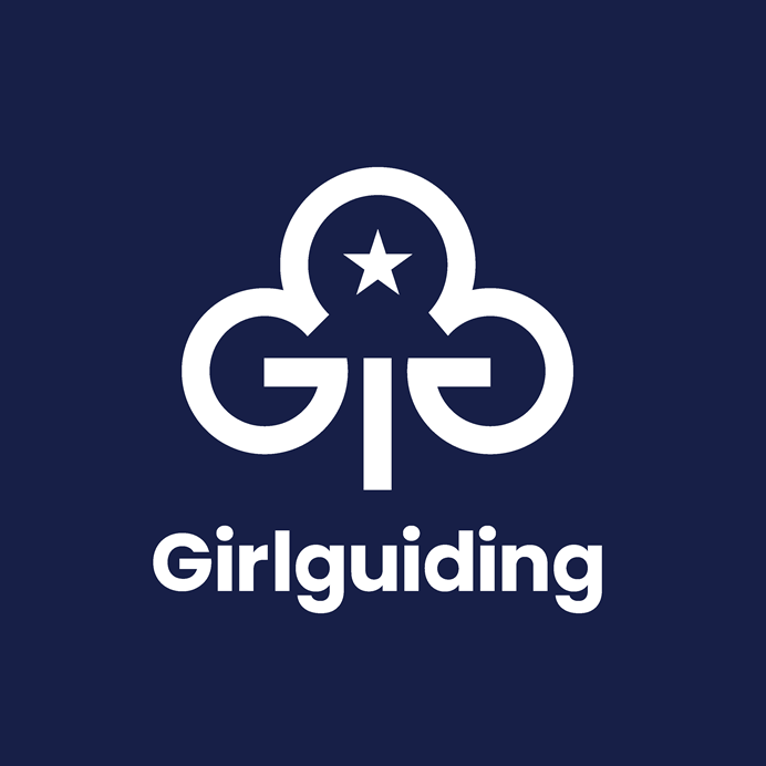 White trefoil on a navy background, with the word Girlguiding written in white underneath. The trefoil has a rounded semi circle at the top. Connected to the left underneath it is a G. Connected to the right underneath it is another G, but flipped horizontally. In the top semi circle is a five pointed star. Between the two Gs is a stem